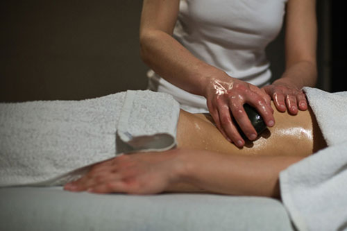 Oil is typically applied first before your hot stone massage.